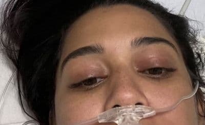 a close up of a person with an oxygen tube in her mouth