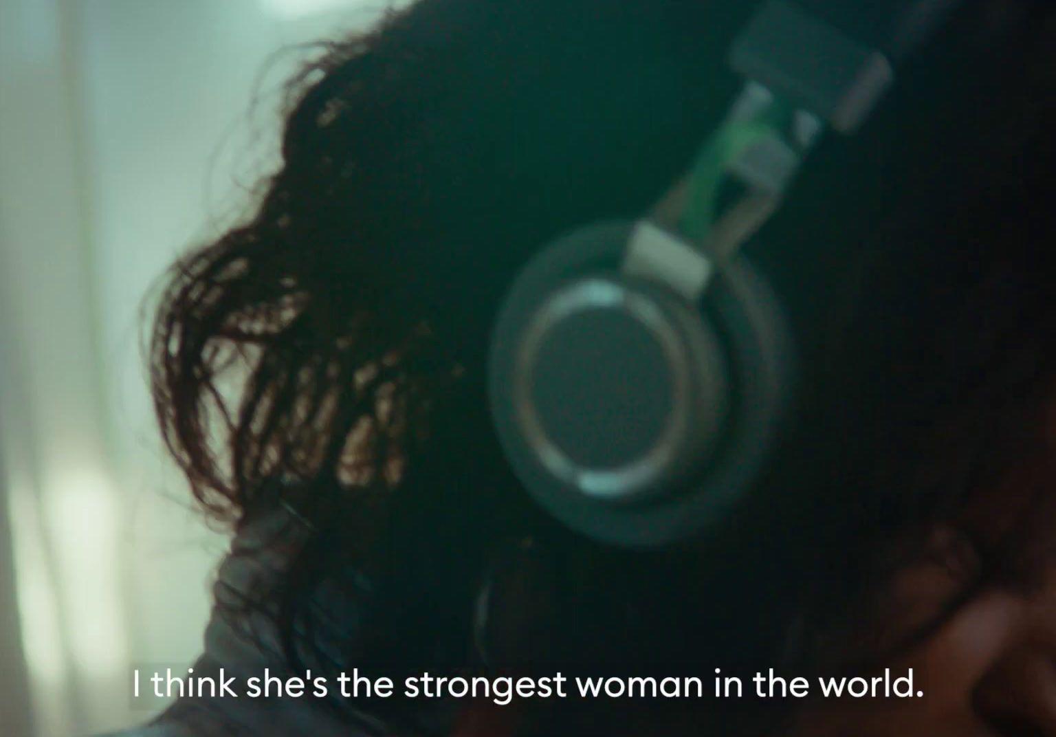 a woman wearing headphones with a quote on it