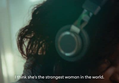 a woman wearing headphones with a quote on it