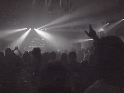 a black and white photo of a crowd at a concert