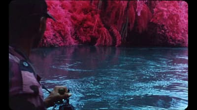 a person is taking a picture of a body of water
