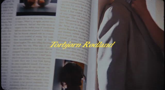 a person standing in front of an open book