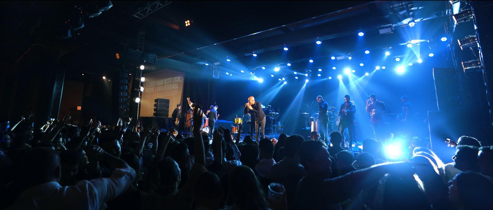 a group of people standing on top of a stage