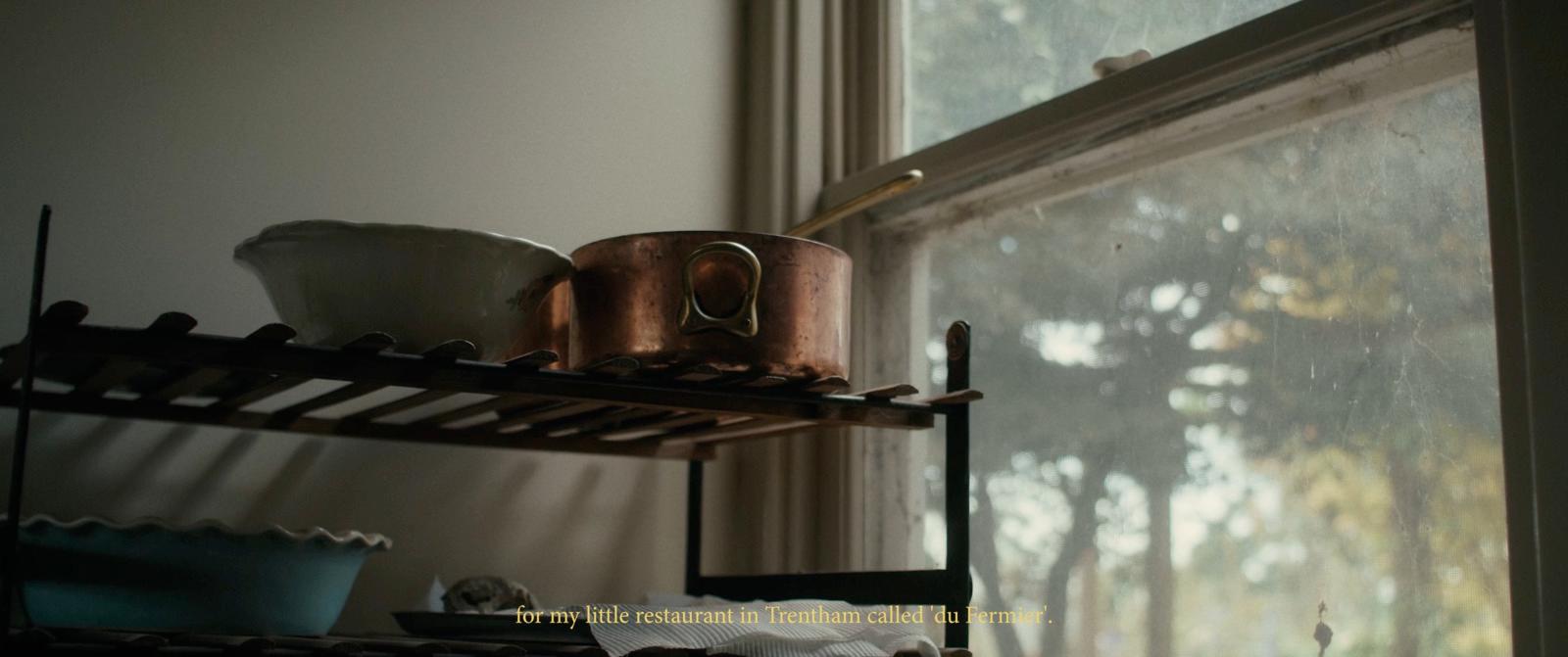 a window sill with pots and pans on it
