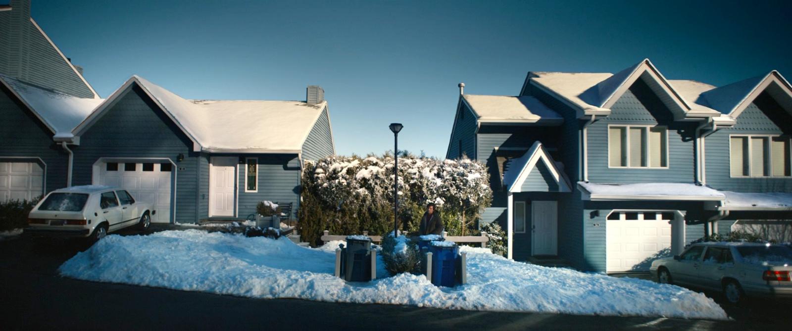 a bunch of houses that are covered in snow