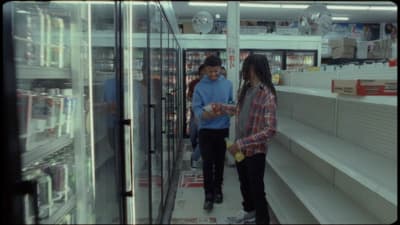 a couple of people that are standing in a store