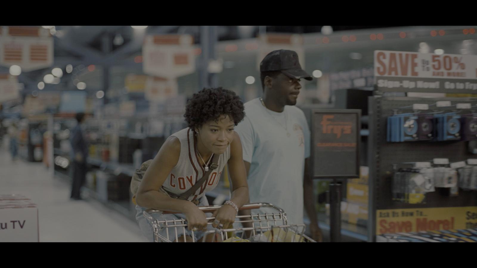 a man pushing a shopping cart in a store