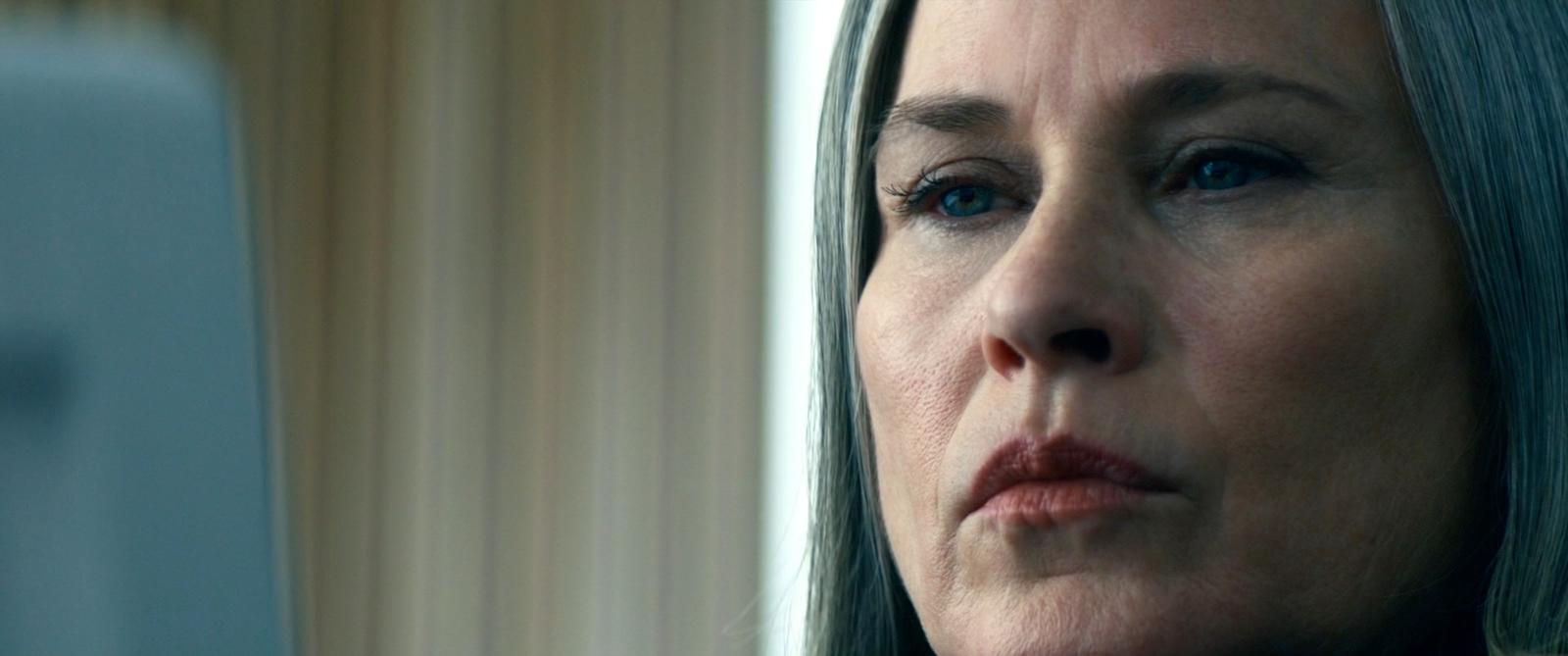 a close up of a woman with a concerned look on her face