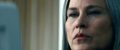 a close up of a woman with a concerned look on her face