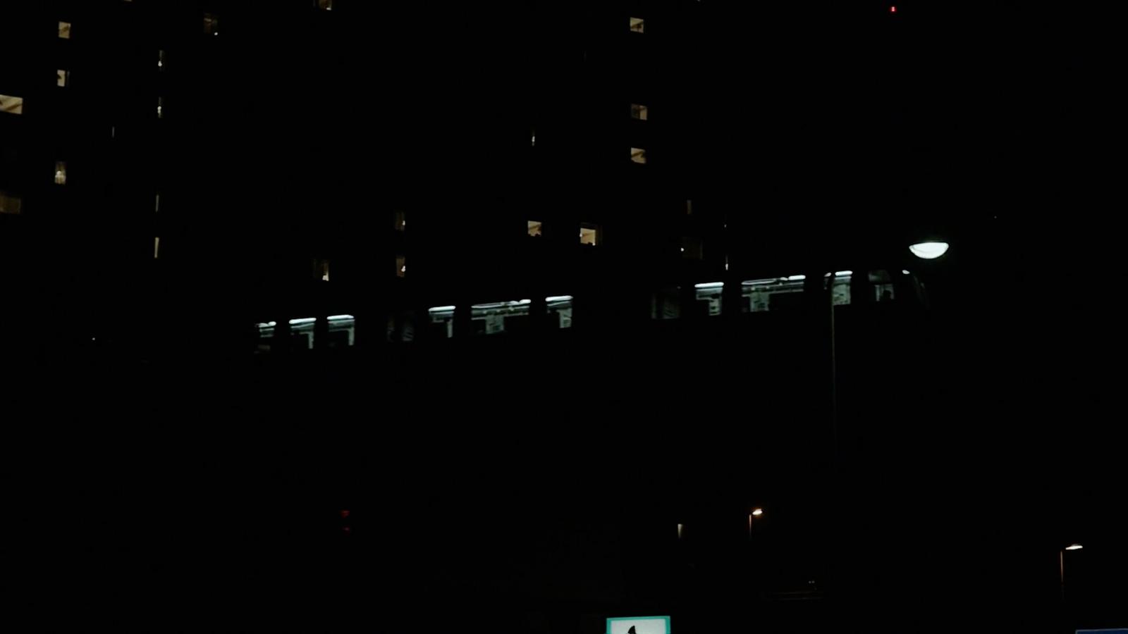 a building lit up at night with street lights