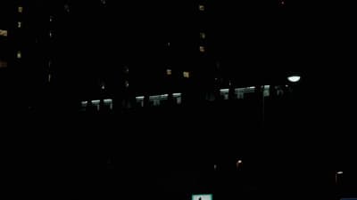 a building lit up at night with street lights
