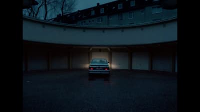 a car parked in a parking garage at night