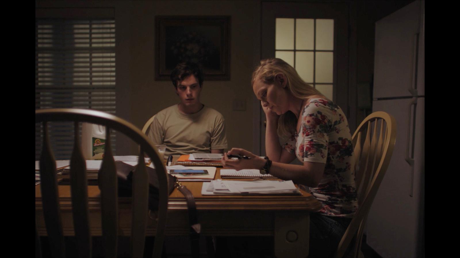a man and a woman sitting at a table