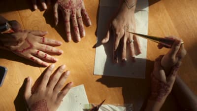 a group of people with their hands painted red