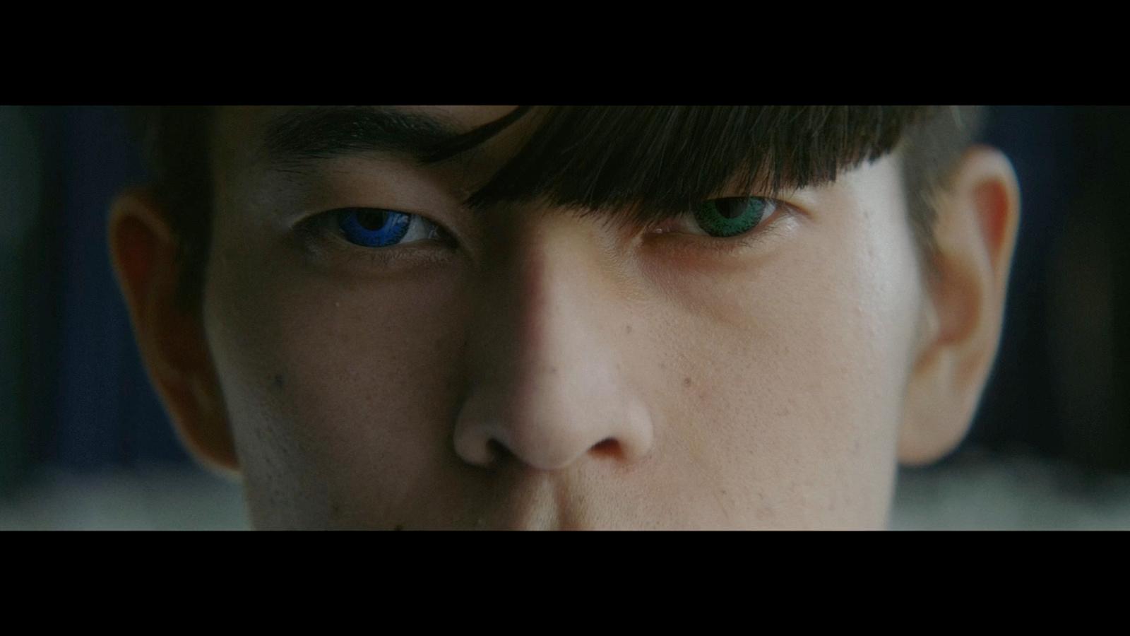 a close up of a person with blue eyes