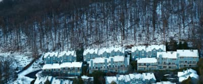 a large group of houses covered in snow