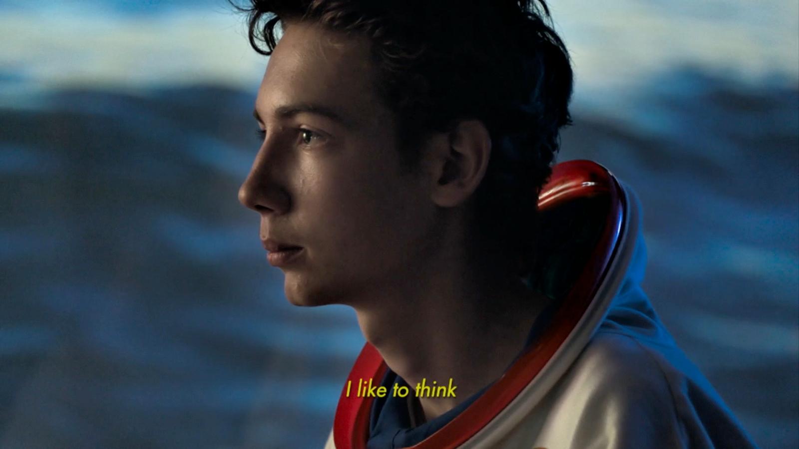 a close up of a person wearing a hoodie