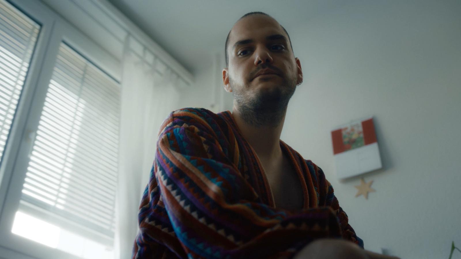 a man with a towel wrapped around his neck