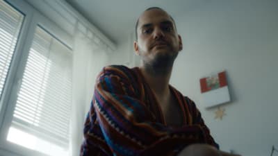 a man with a towel wrapped around his neck