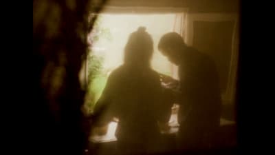a couple of people that are standing in a room