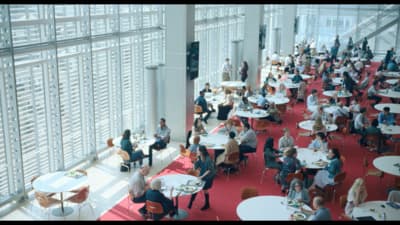 a room filled with lots of tables and chairs