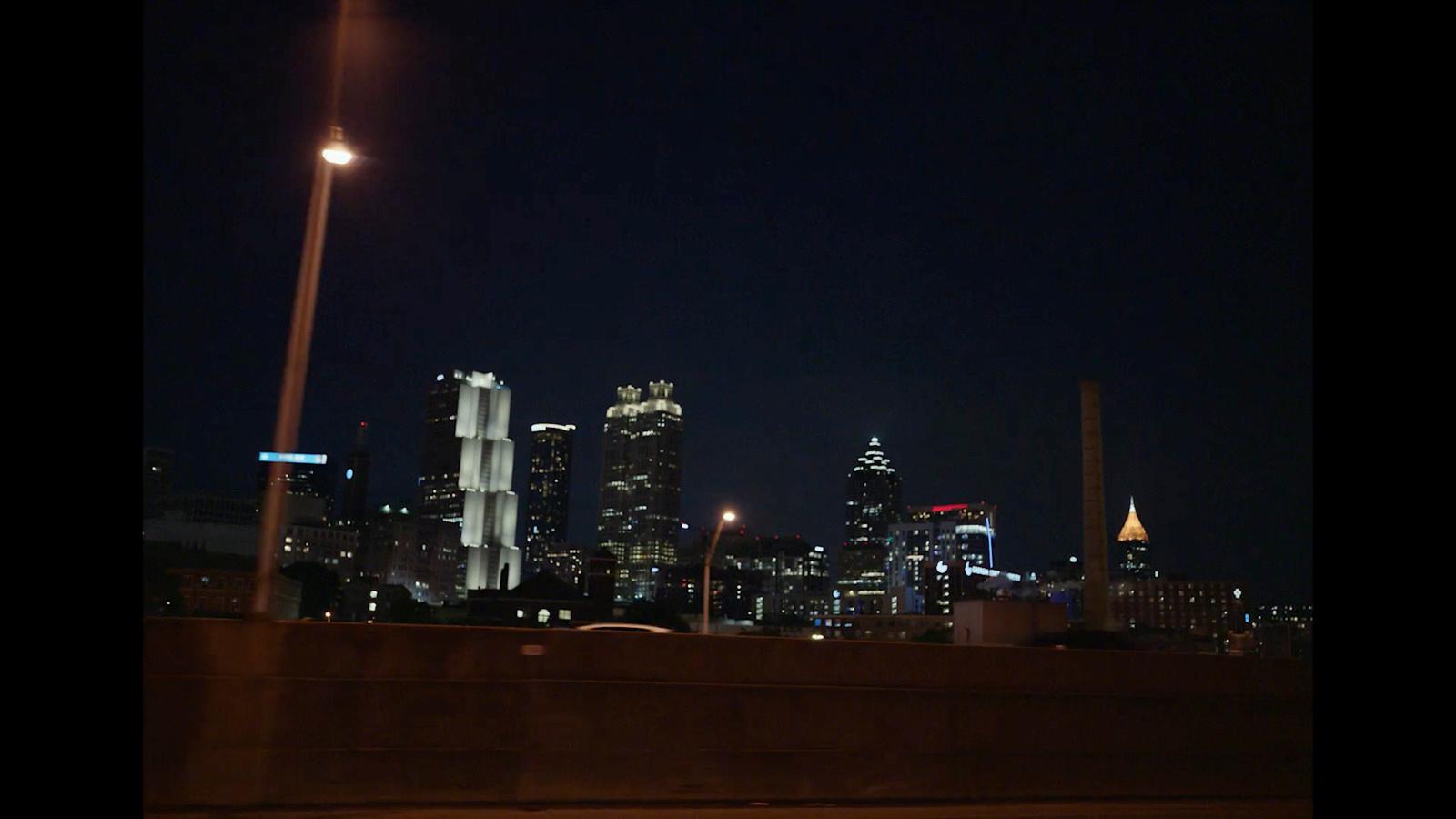 a view of a city at night from a bridge