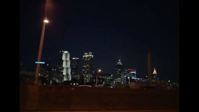 a view of a city at night from a bridge