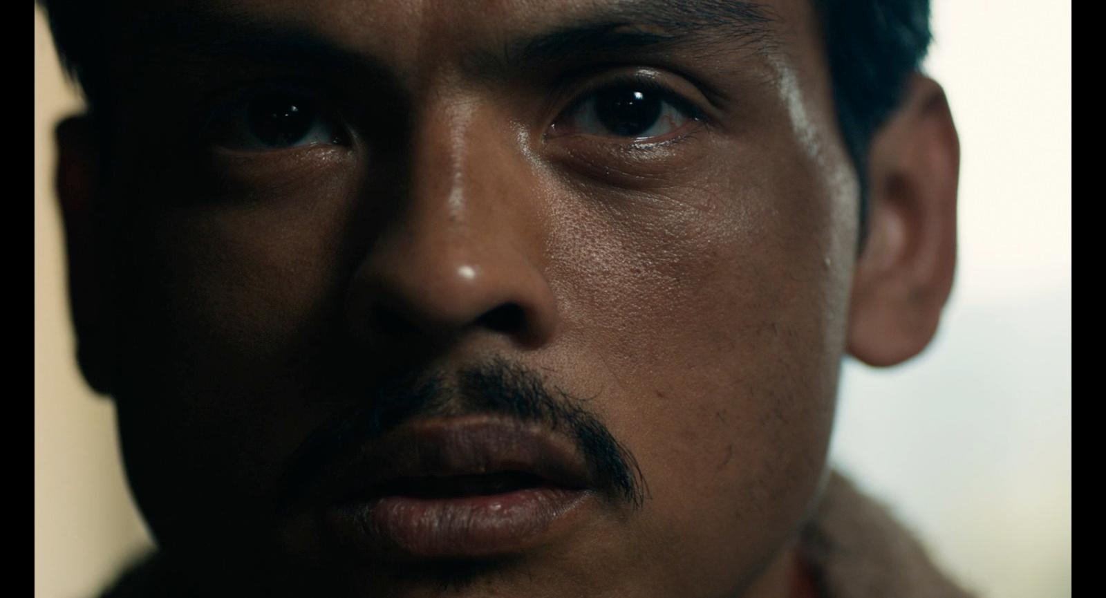 a close up of a man with a mustache
