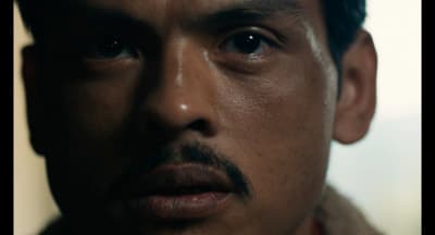 a close up of a man with a mustache