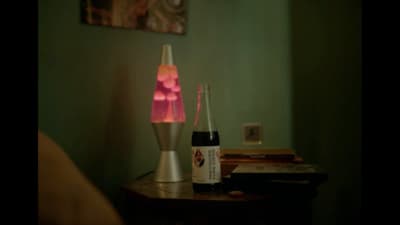 two bottles of beer sitting on top of a table
