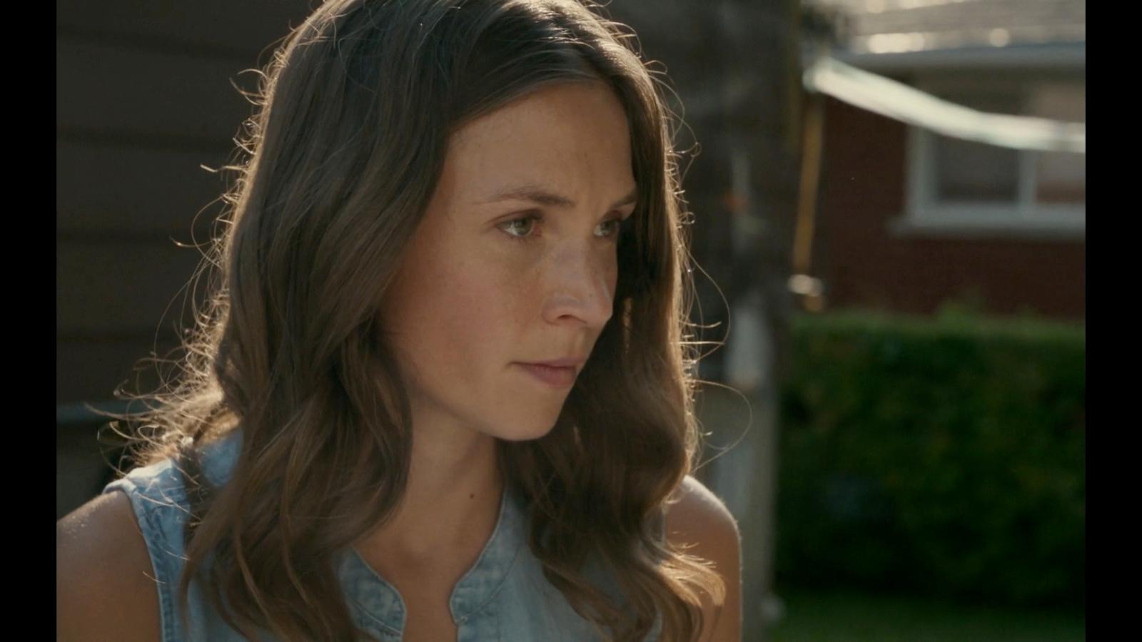 a close up of a person with long hair