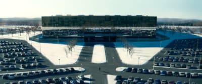 a parking lot filled with lots of parked cars