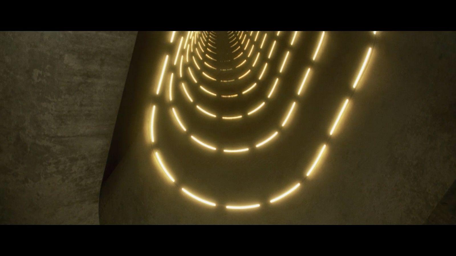 a tunnel that has a lot of lights on it