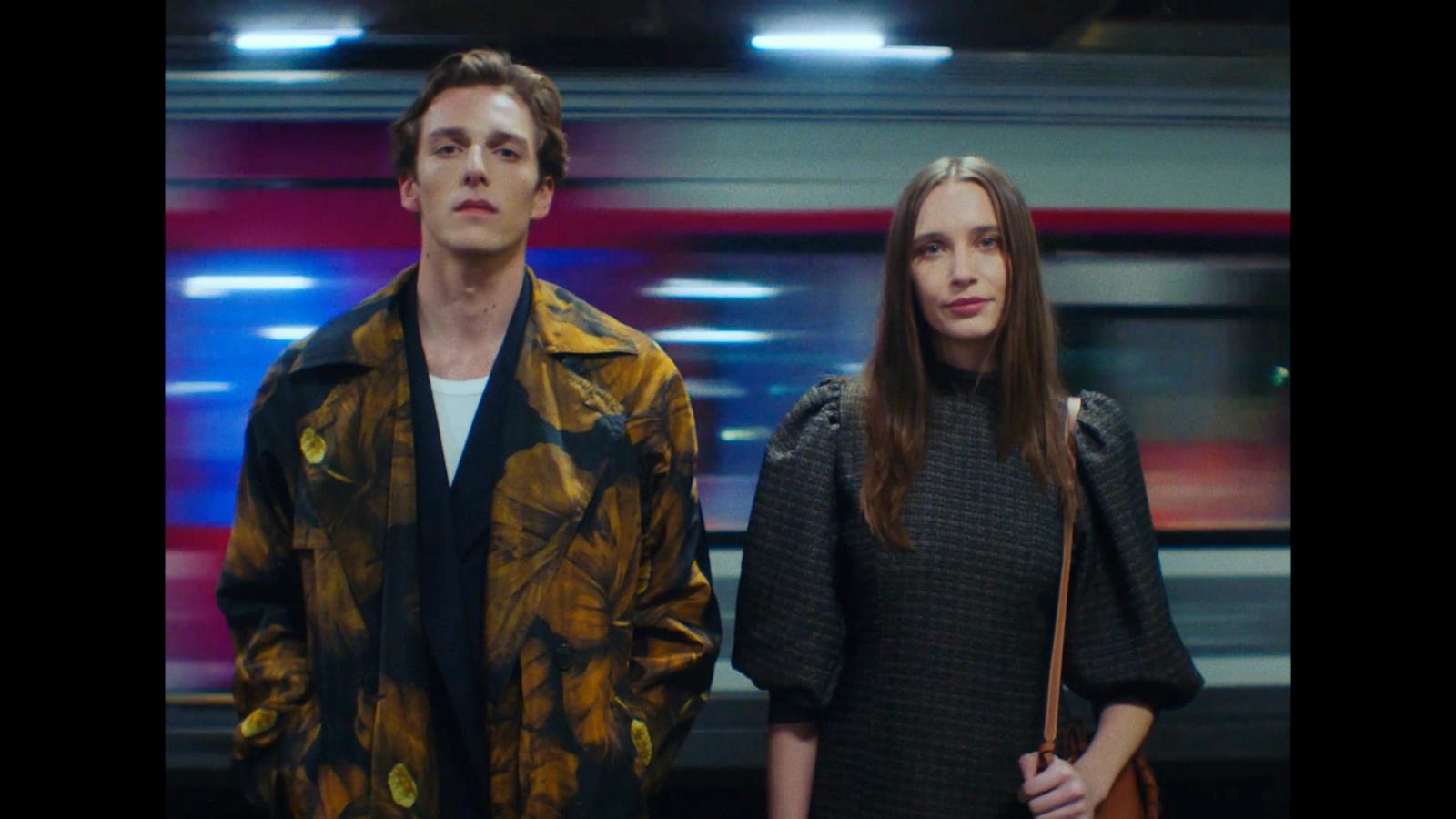 a man and a woman standing next to each other