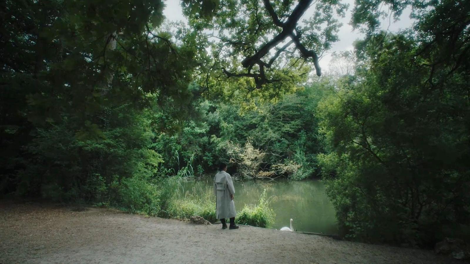 a person standing in front of a body of water