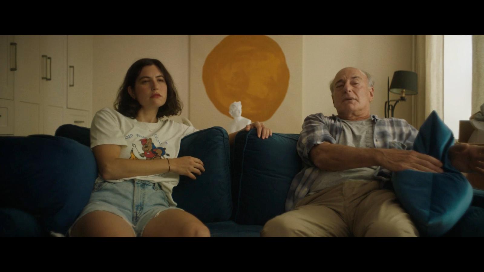 a man and a woman sitting on a couch