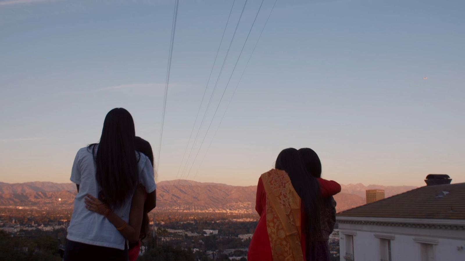 a couple of women standing next to each other