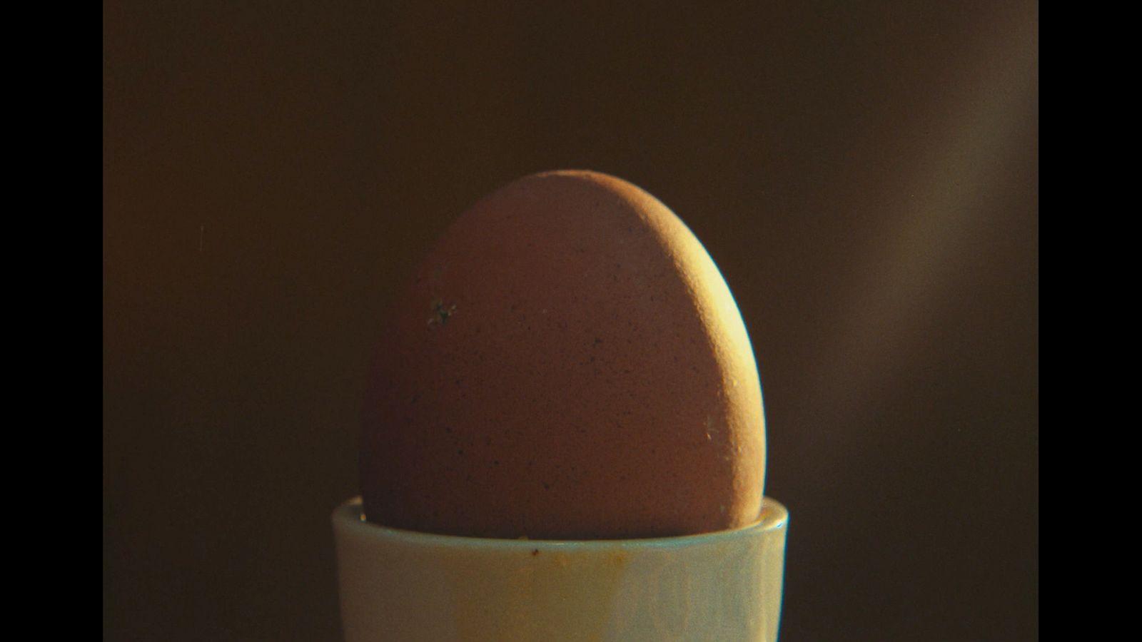 an egg in a cup on a table