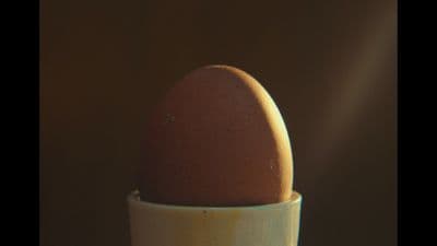 an egg in a cup on a table