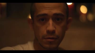 a close up of a person with a serious look on his face