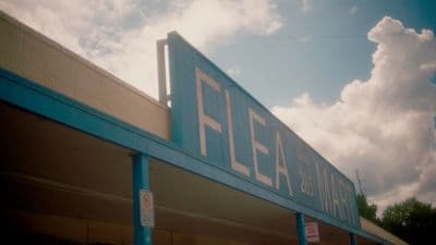 a building with a sign that says flea on it
