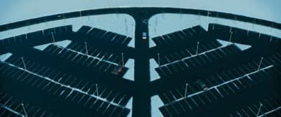 an aerial view of a bridge with cars driving on it