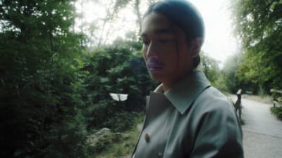 a man standing in the middle of a forest