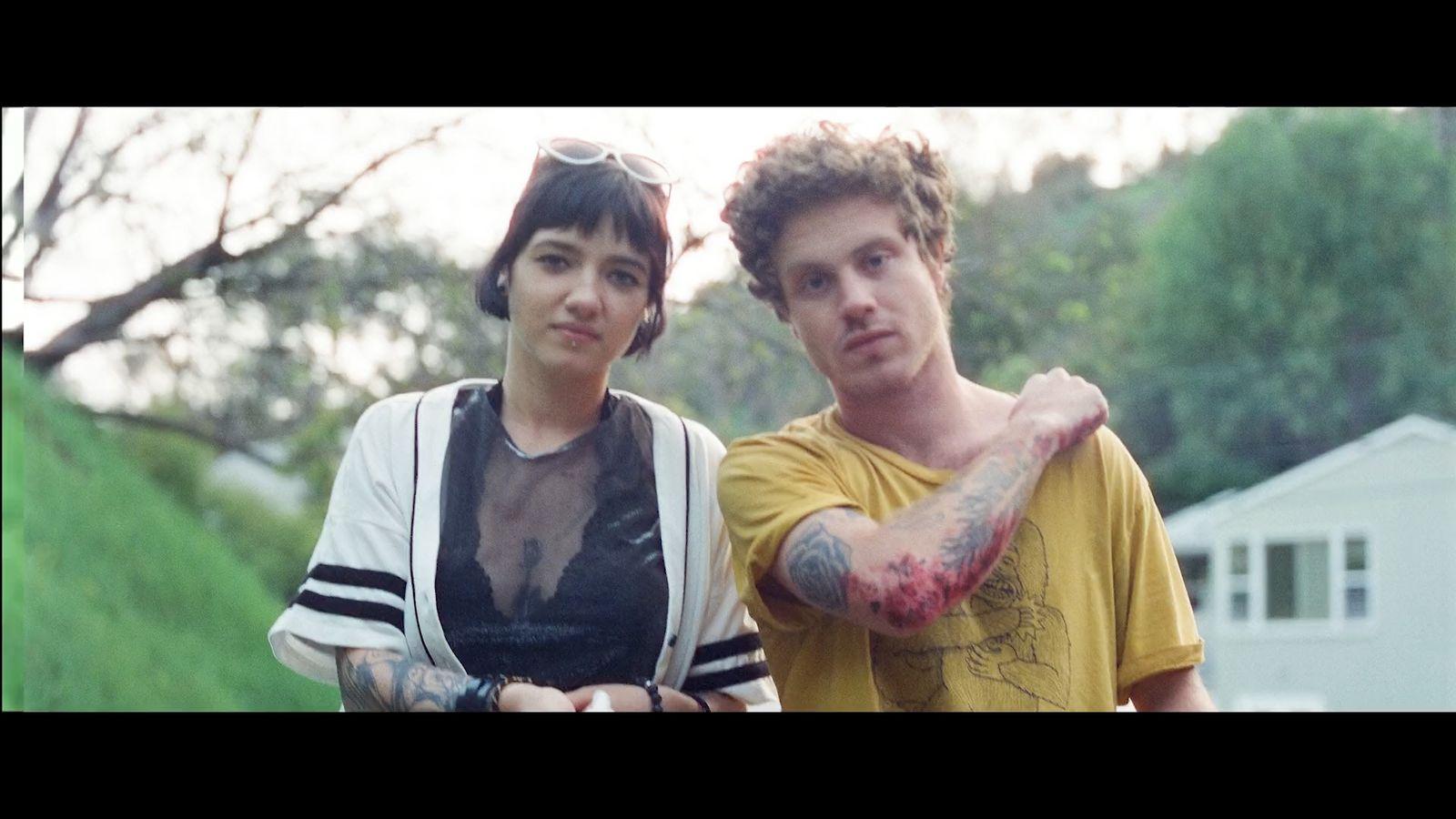 a man and a woman standing next to each other