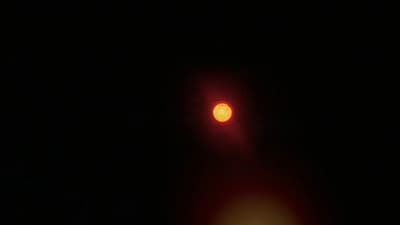 a street light in the dark on a dark night