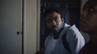 a man standing next to a woman in a room