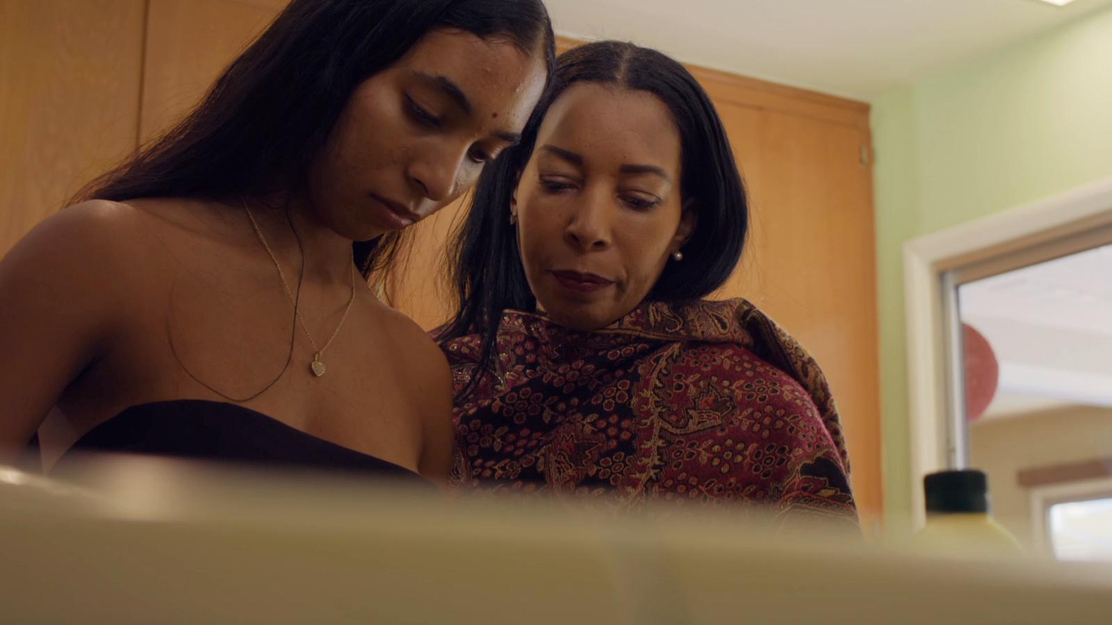 a couple of women standing next to each other