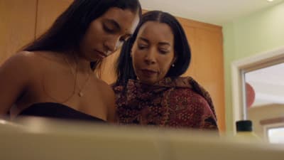a couple of women standing next to each other