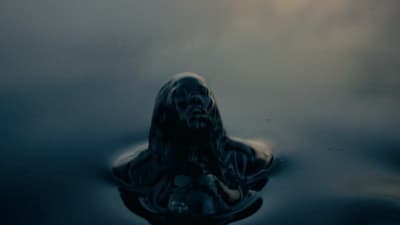 a woman floating in a body of water