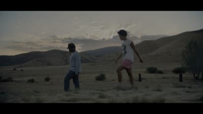 a couple of people that are standing in the dirt
